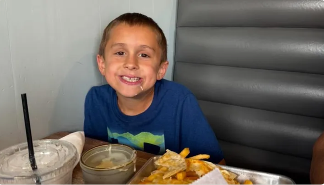 <p>A photo of Michael Millett, an eight-year-old boy who was mauled and killed by a pair of dogs near his home in Volusia County, Florida, on January 13</p>